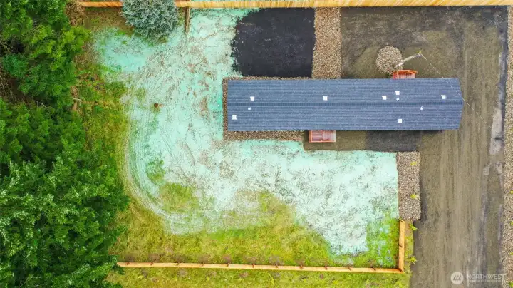 Aerial view showcasing lot size and tree privacy. Lots of parking space