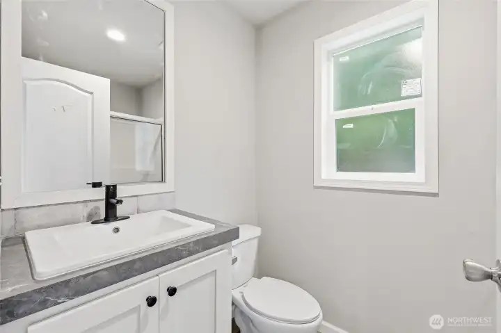Primary bath with shower and single vanity
