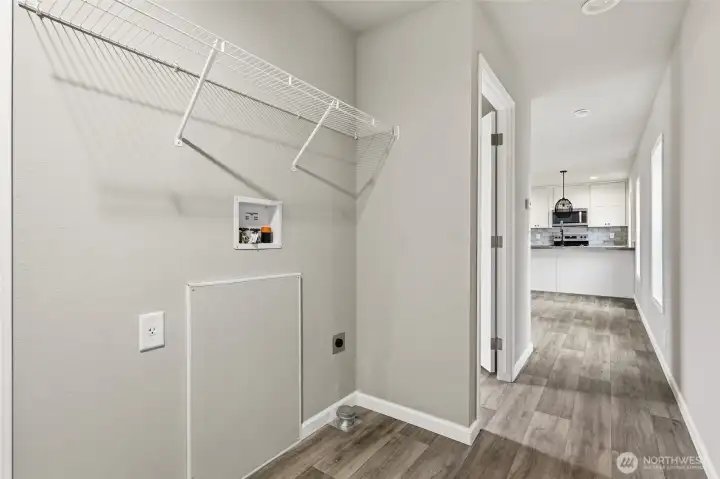 Laundry space is located just off the back door entrance.