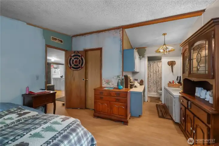 Primary bedroom looking to primary bathroom.