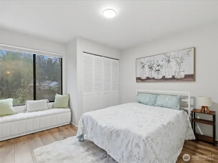 Bedroom with large window overlooking the green belt