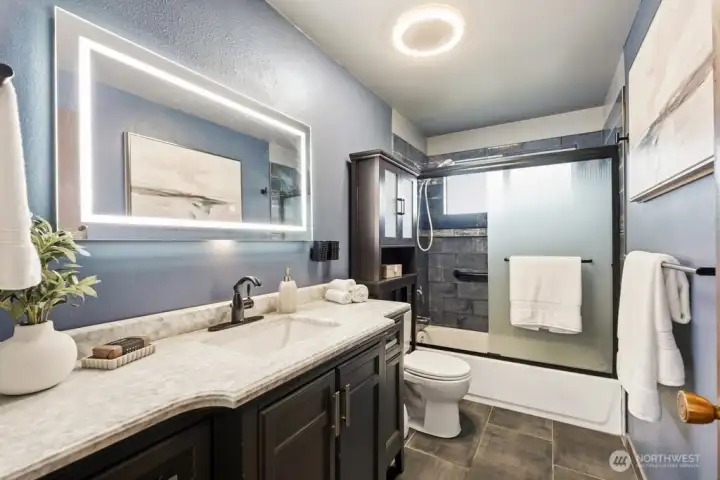 Updated bath with lighted mirror