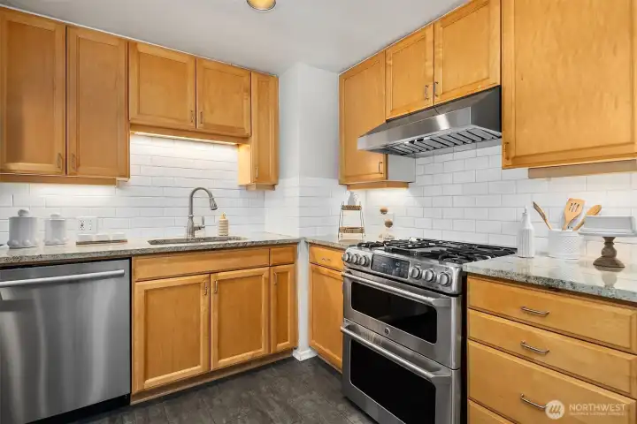 Kitchen with stainless appliances and subway tile detail Kitchen with stainless appliances and subway tile detail