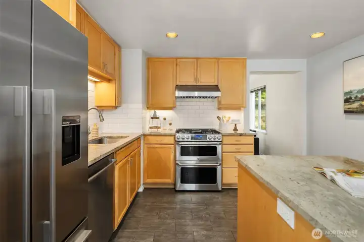 Kitchen with stainless appliances and subway tile detail Kitchen with stainless appliances and subway tile detail
