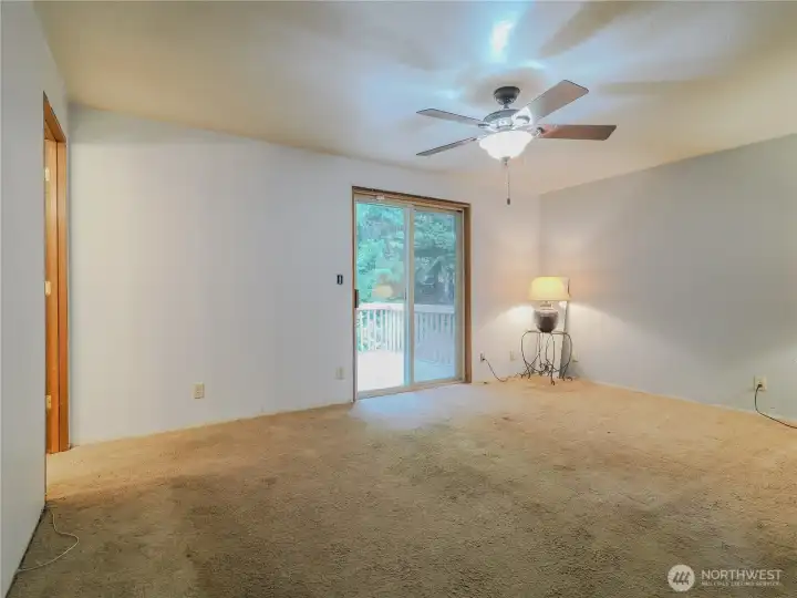 Primary bedroom with 3/4 bath and secluded deck