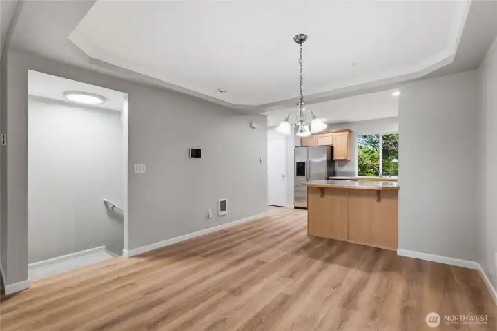 Large dining area with stairs to lower level