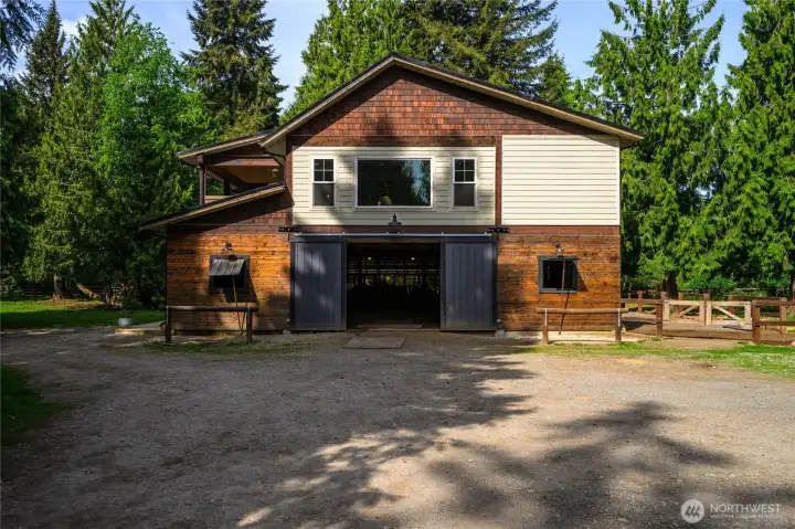 Custom built in 2020 residence above, barn below