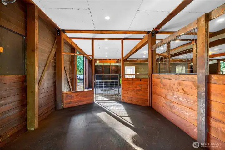 Across 12’x12’ wash rack with custom interlocking mat flooring, hot and cold water, cross ties and floor drain.