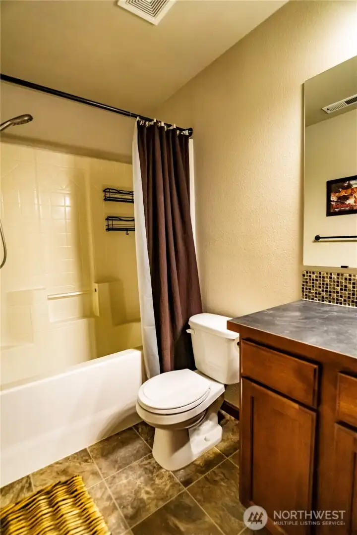 SECONDARY BATH UPSTAIRS...