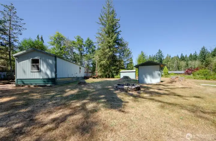 ADU on Parcel #2 with outbuilding.  Main house roof can be seen on the far right of photo