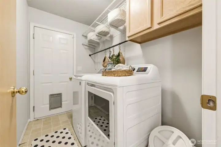 Laundry room that leads into garage