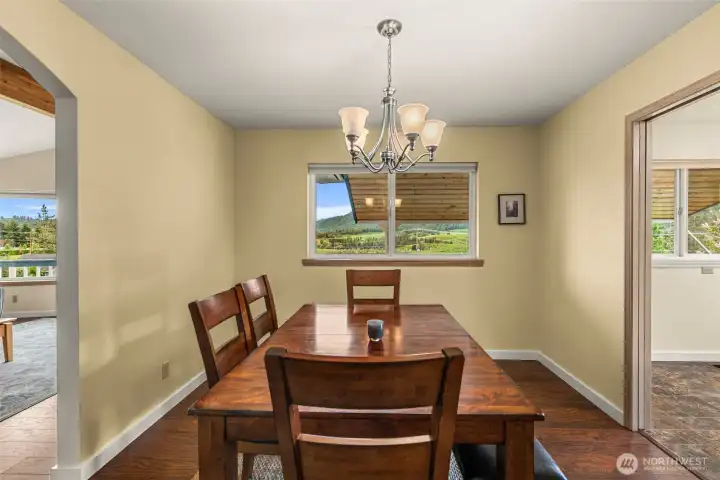 Positioned to capture peaceful mountain and territorial views, the dining area offers a warm and inviting setting