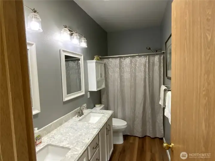 Primary bathroom remodeled with new toilets and dual sinks Primary bathroom remodeled with new toilets and dual sinks