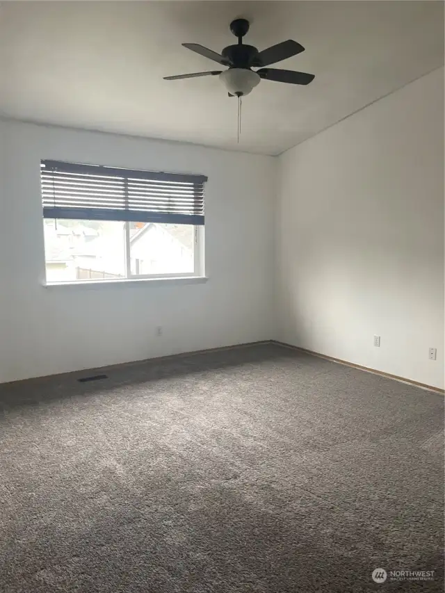 Spacious Primary Bedroom Upstairs with lots of natural light.