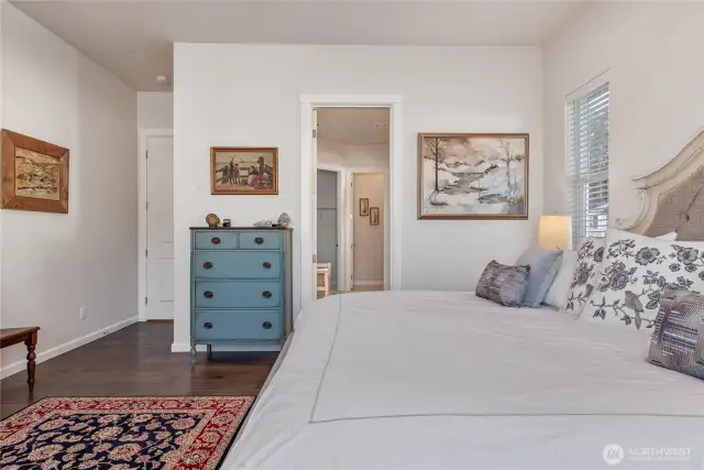 Primary bedroom leading into bathroom