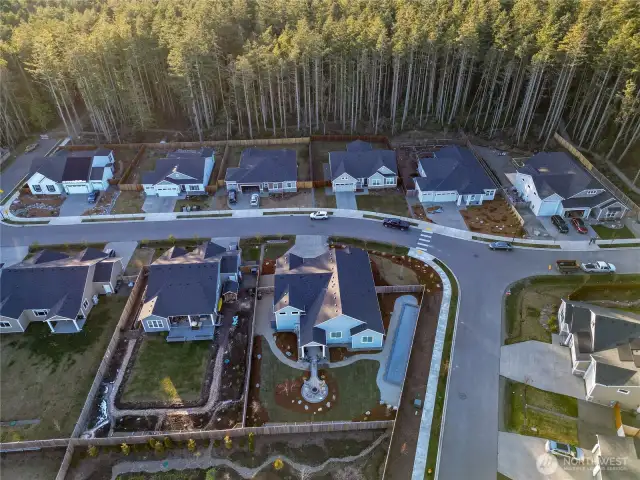 Aerial picture.  Home is right corner lot with the narrow Bocce Court.