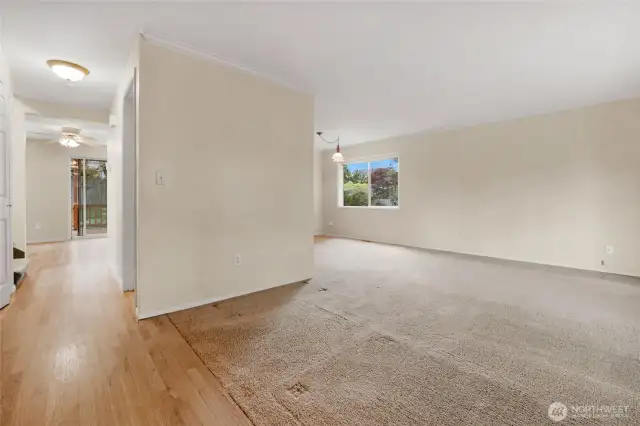 Straight ahead to the kitchen, kitchen dining area, and sitting area complete with a woodburning fireplace.