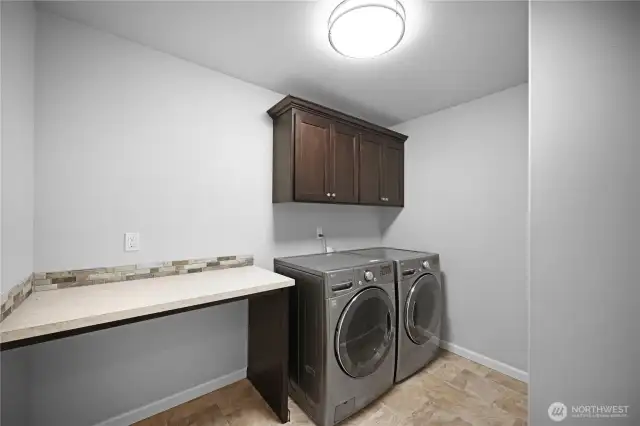 Upstairs laundry room with washer & dryer included.