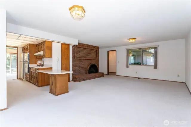 Kitchen & family room with 2nd of two fireplaces