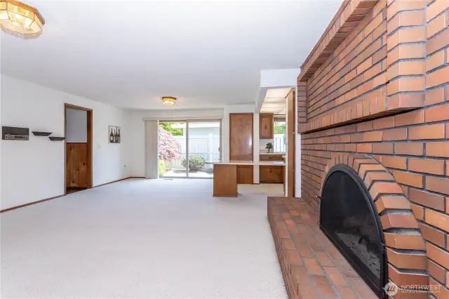 Family room, door & wall at left in front of additional roof