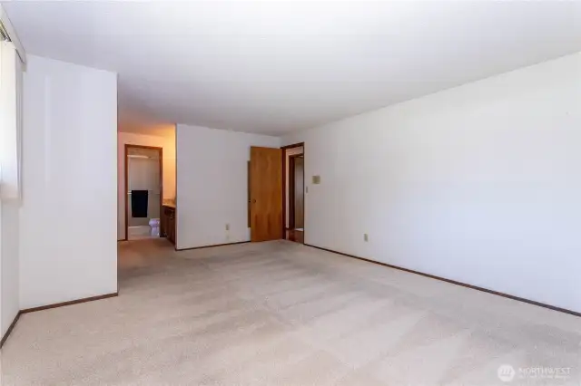 primary bedroom, door to left leads to bathroom
