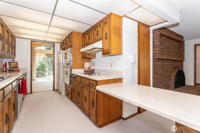 Galley kitchen opens to family room & dining room; microwave/convection as well as standard oven.  Glass-top cook-top; 2 spacious pantries.