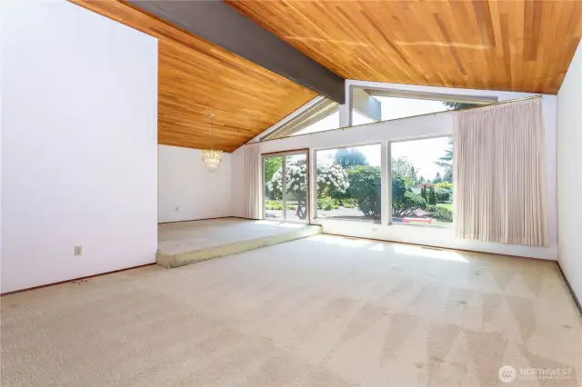 Living/dining with large picture windows & slider to rear deck & spacious rear patio