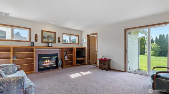 Cozy living room with slider to back yard and patio