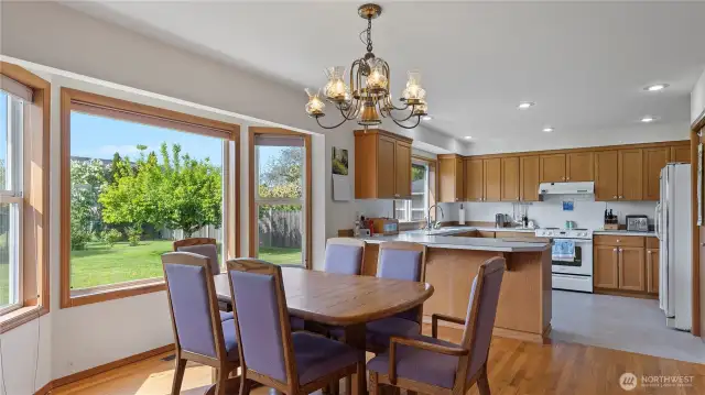 Large open kitchen with big bay window