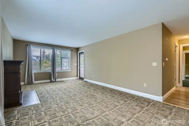 The automatic blinds will keep things cool during the late summer sun.  The door leads to a wonderful deck with new flooring and railings.