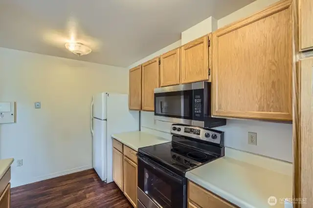 This home features laminate hardwood floors, ideal for heavy traffic.