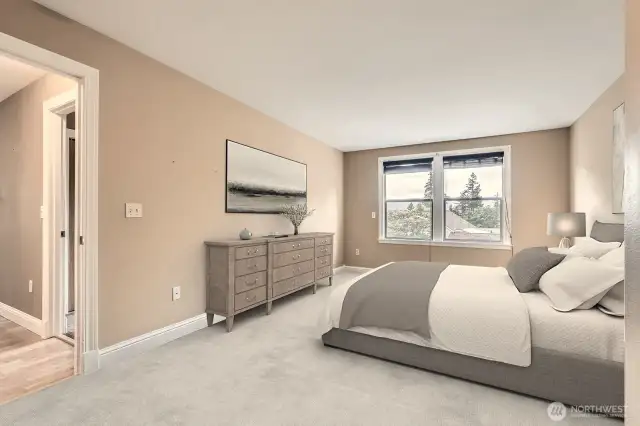 The primary bedroom features new carpeting and lovely territorial views to the west.  Virtually staged.