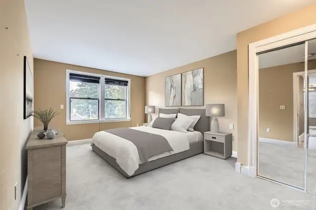 The large primary suite also boasts brand new carpet and automatic blinds that will keep things cool in the summertime. Virtually staged.