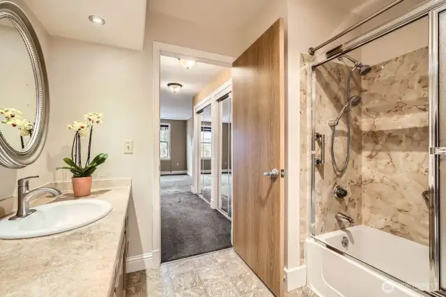 The Primary Suite features a full bath and a wall of mirrored closets. (The carpet has been replaced)
