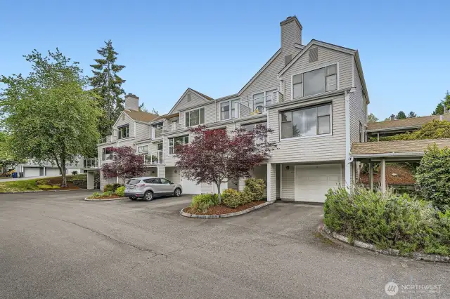 The unit is directly above the garage on the right at the end of the building.