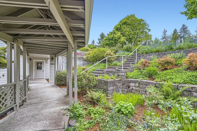As you walk from the elevator toward the exterior door, you'll see manicured landscaping and plantings.