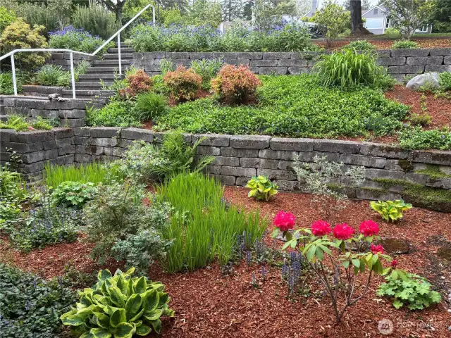 Gorgeous landscaping will greet you and your guests in all seasons.
