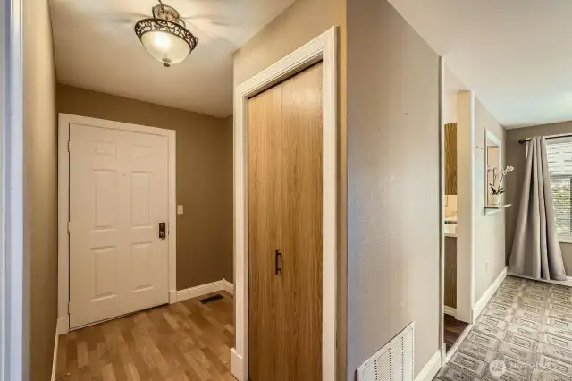 The front entry provides extra space for a table or bench and decorating.