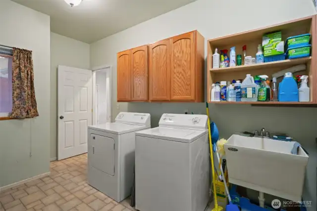 Mud Room/Laundry Room with Deep sink and lots of storage. The exterior door off the laundry room leads to the detached garage.