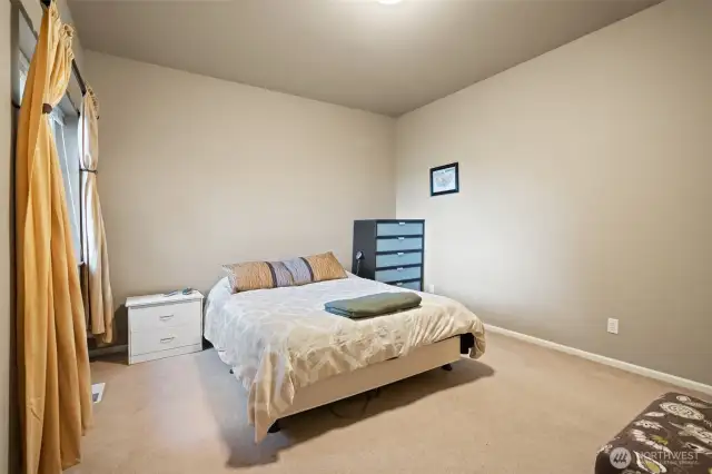 Second ensuite bedroom with full bath, walk in closet, and a water view.