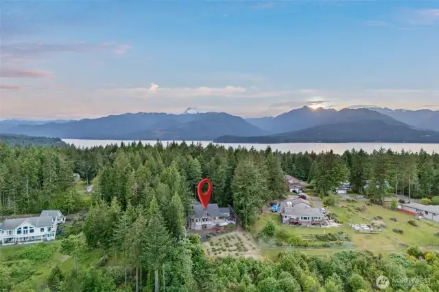 A view of the home from the east. Hood Canal and Olympics to the west. Seabeck Scenic beach state park and the Misery point boat launch are by.