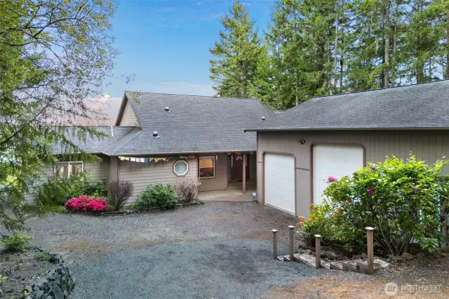 This lot is tucked away and private. There is extra parking to the right of the shop/garage.