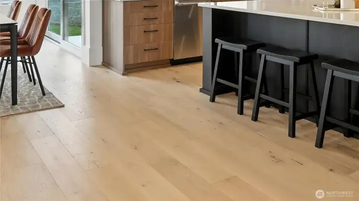 Beautiful wide-plank flooring delivers both visual impact and timeless elegance.