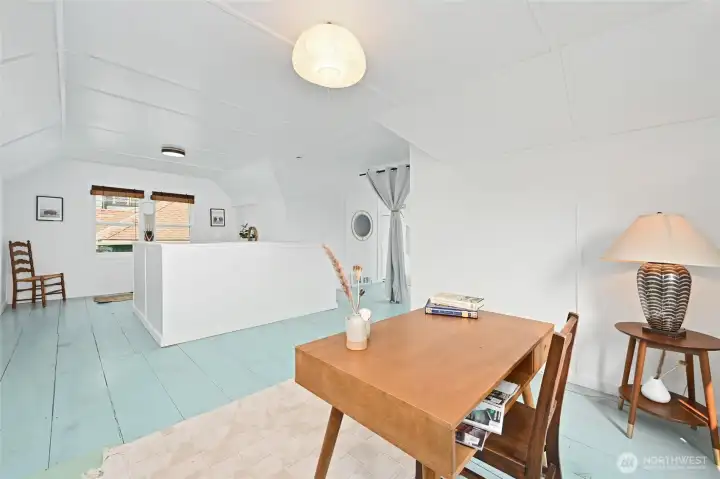 featuring a small sitting area in the first bay at the top of the stairs,