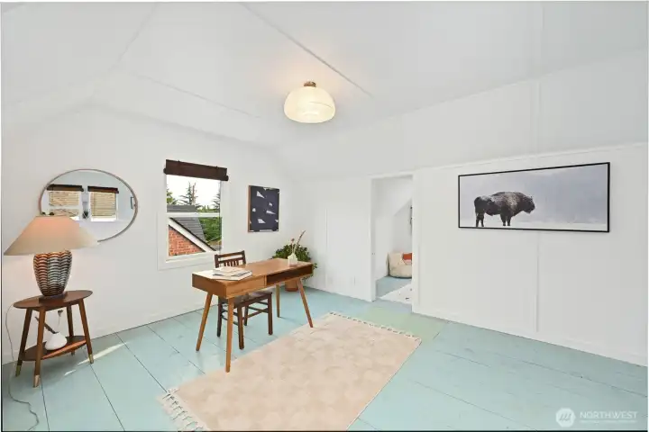 and an office area or future bedroom in a second bay