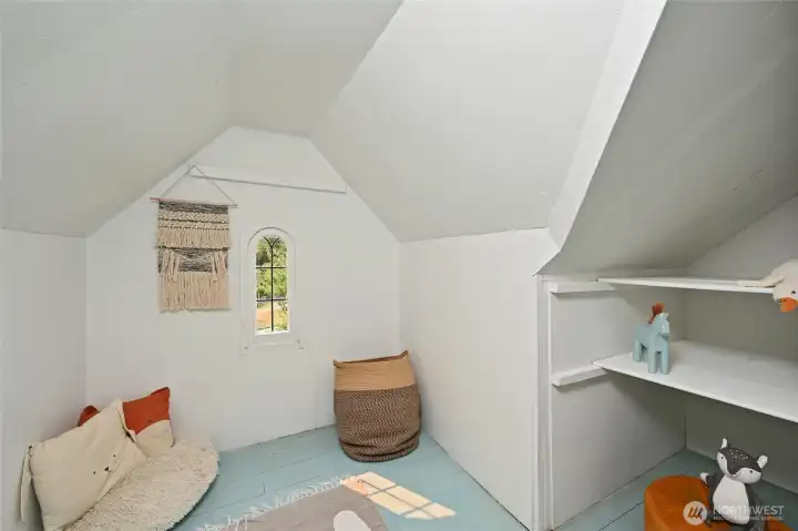 with a precious alcove in a dormer setup as a kids playroom.
