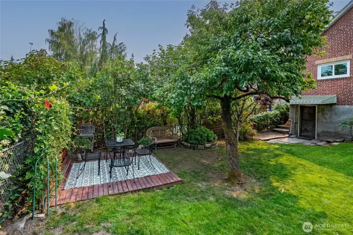 Nestled in the back corner of the yard is a second deck for eating and lounging in the midst of backyard activities.