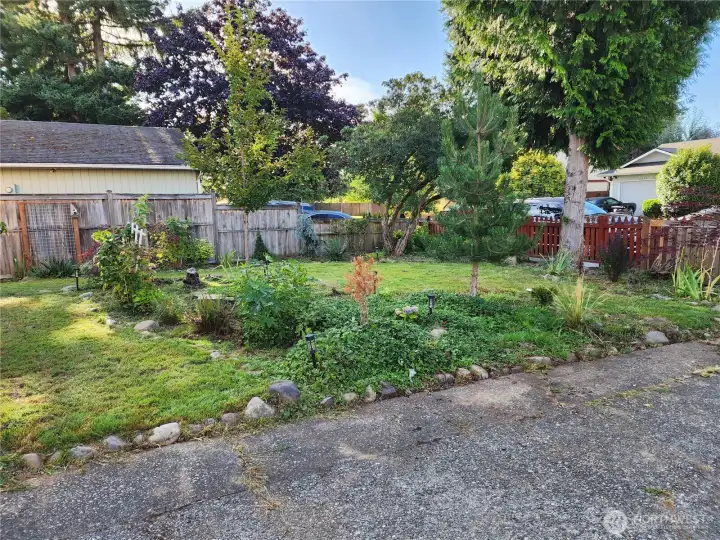 Front yard ready for your green thumb.