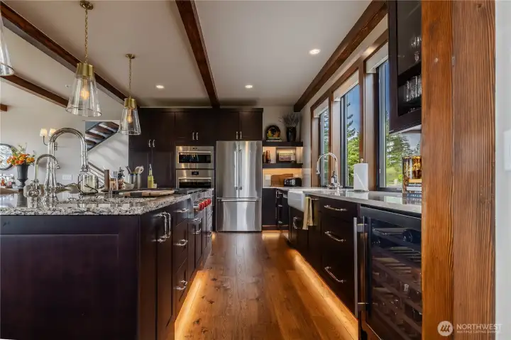 Kitchen is fully equipped all the way down to a handy wine fridge with high end Wolfe, Thermador, Bosch, and LG appliances