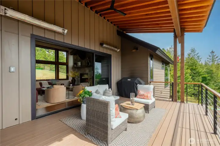 Deck off great room with dual 220V heaters and a fan.